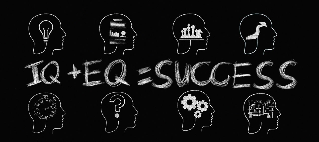 Intelligence Quotient plus Emotional Quotient equals to Success, written on a blackboard